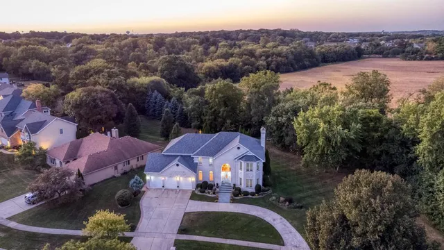 an aerial view of residential houses and outdoor space