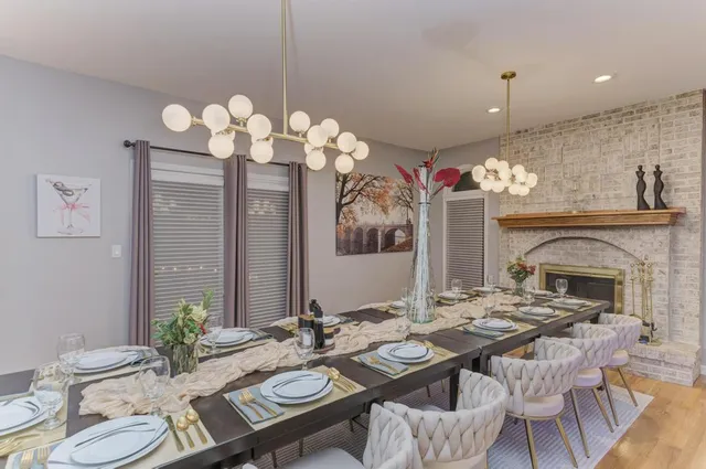 a living room with furniture fireplace and window