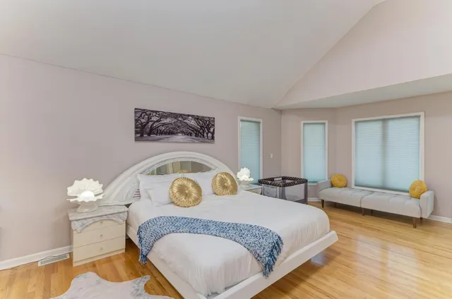 a living room with a flat screen tv and a glass door