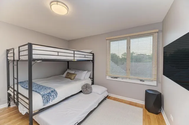 a bathroom with a granite countertop toilet a sink and a mirror