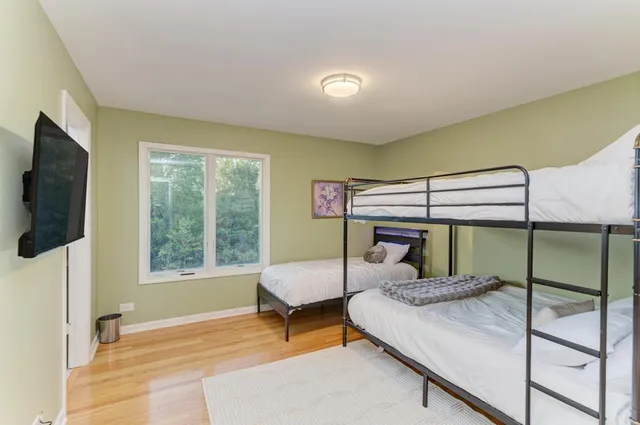 a dining hall with stainless steel appliances granite countertop a granite counter tops and a view of living room