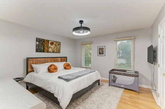 a kitchen with stainless steel appliances granite countertop a sink a stove and a wooden cabinets