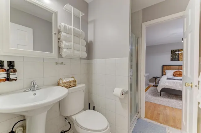 a room with wooden floor and windows