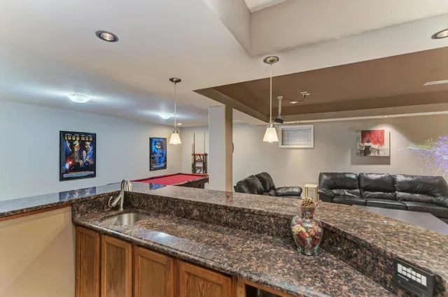 an aerial view of house with yard swimming pool and outdoor seating