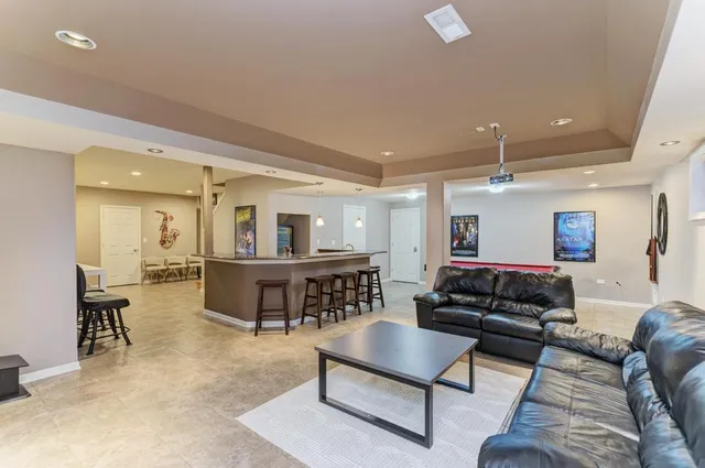 a view of a house with a yard and deck