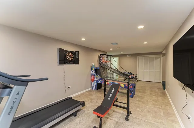 a view of a house with a big yard and large trees