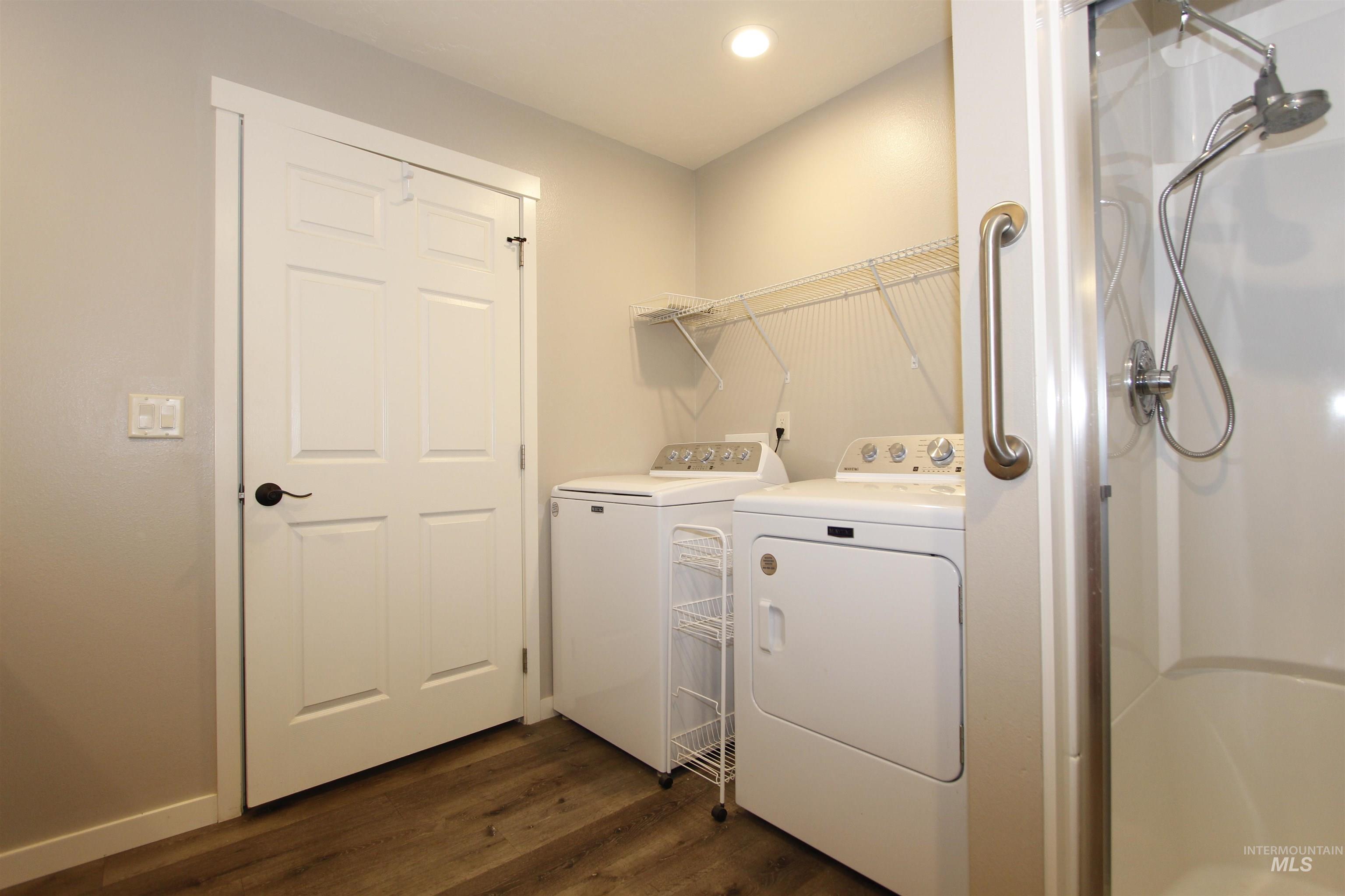 3434 5th Street, Unit B Lewiston, ID 83501 - Photo 11 of 19 Washroom with dark wood-type flooring, washer and dryer, and recessed lighting