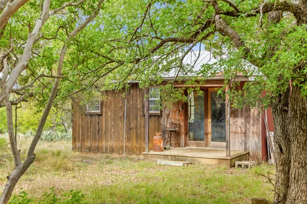 front view of a house with a tree