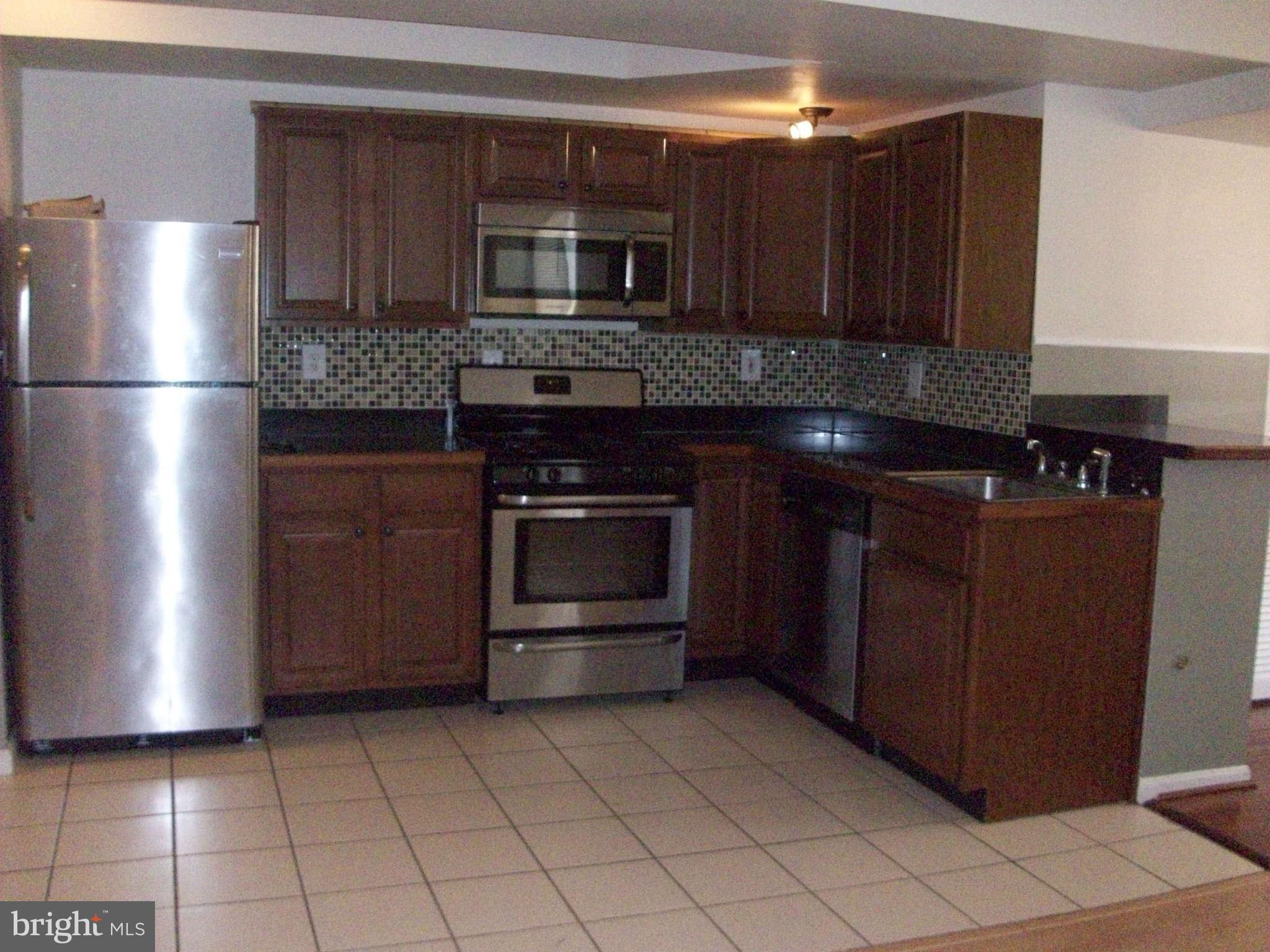 1111 Mt Olivet Road Northeast Washington, DC 20002 - Photo 11 of 15 Upper level Kitchen