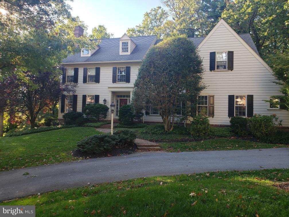 4 Paul Road Wayne, PA 19087 - Photo 2 of 46 a front view of a house with a garden and plants