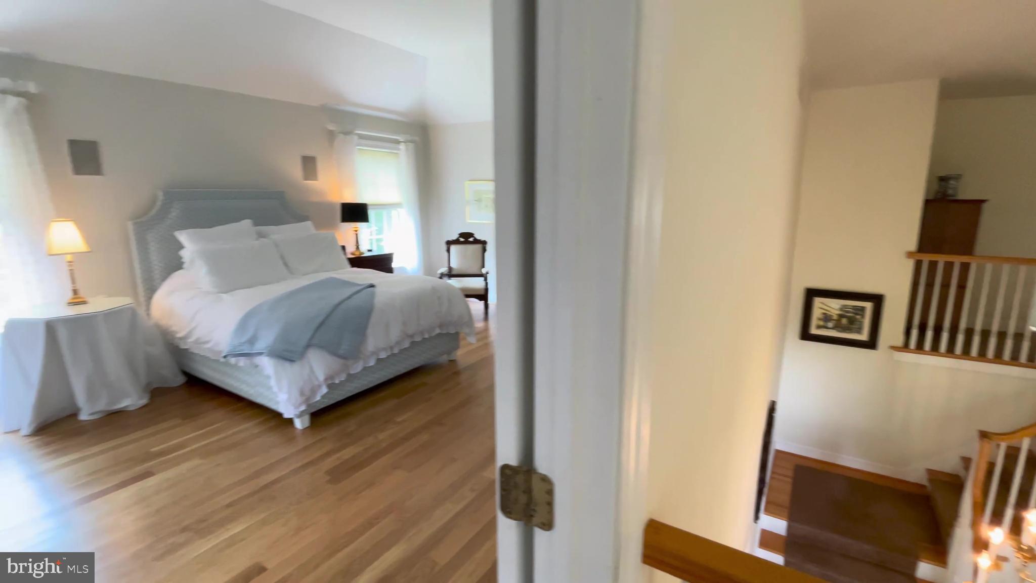 4 Paul Road Wayne, PA 19087 - Photo 21 of 46 a bedroom with a bed and a flat tv screen on a dresser