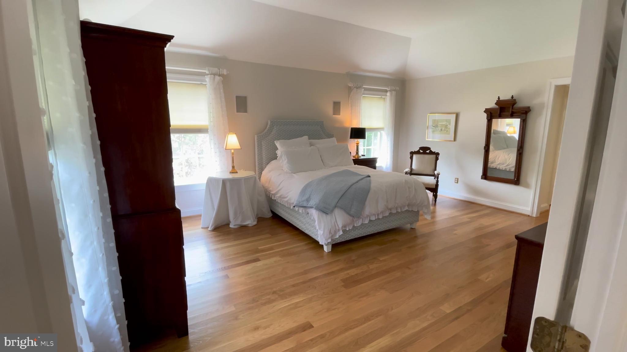 4 Paul Road Wayne, PA 19087 - Photo 22 of 46 a spacious bedroom with a bed and a mirror