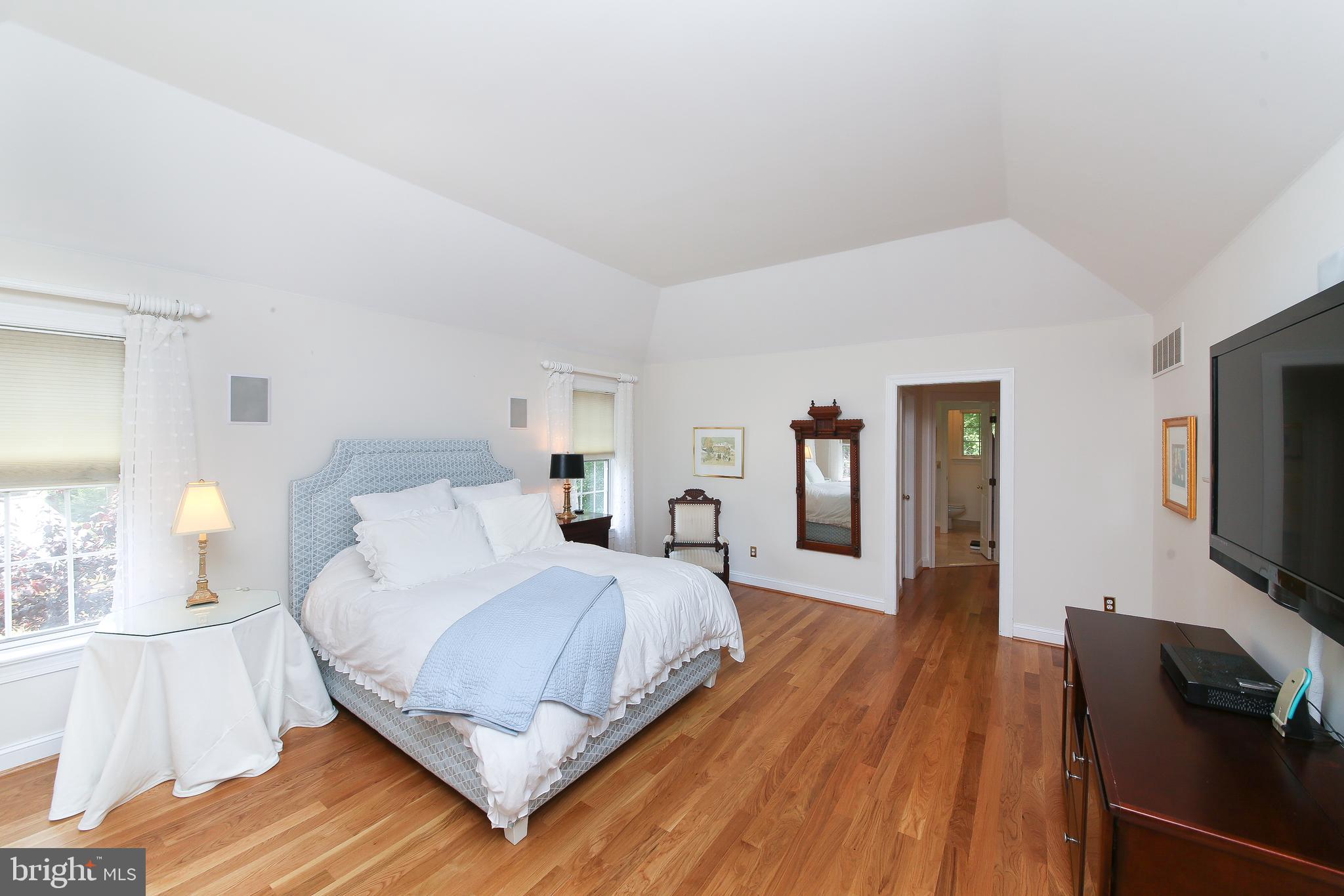 4 Paul Road Wayne, PA 19087 - Photo 24 of 46 a bedroom with a bed and a flat tv screen on a dresser