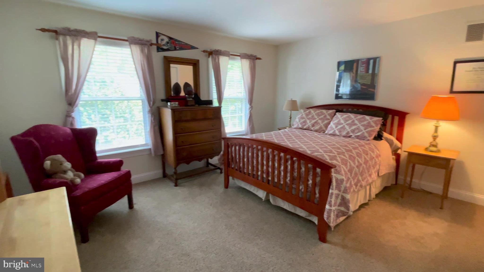 4 Paul Road Wayne, PA 19087 - Photo 29 of 46 a bedroom with a bed and wooden floor