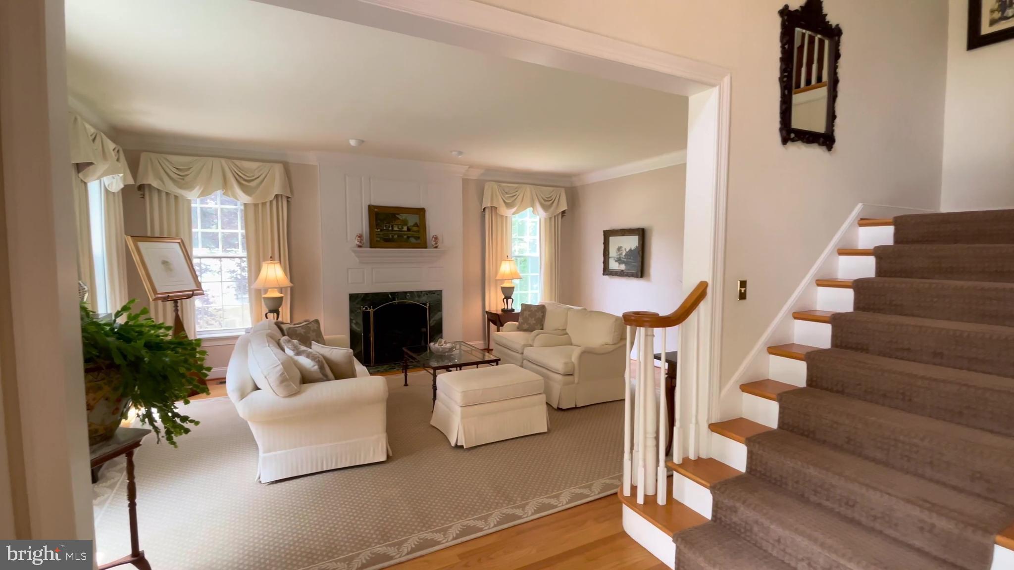 4 Paul Road Wayne, PA 19087 - Photo 5 of 46 a living room with furniture fireplace and potted plants