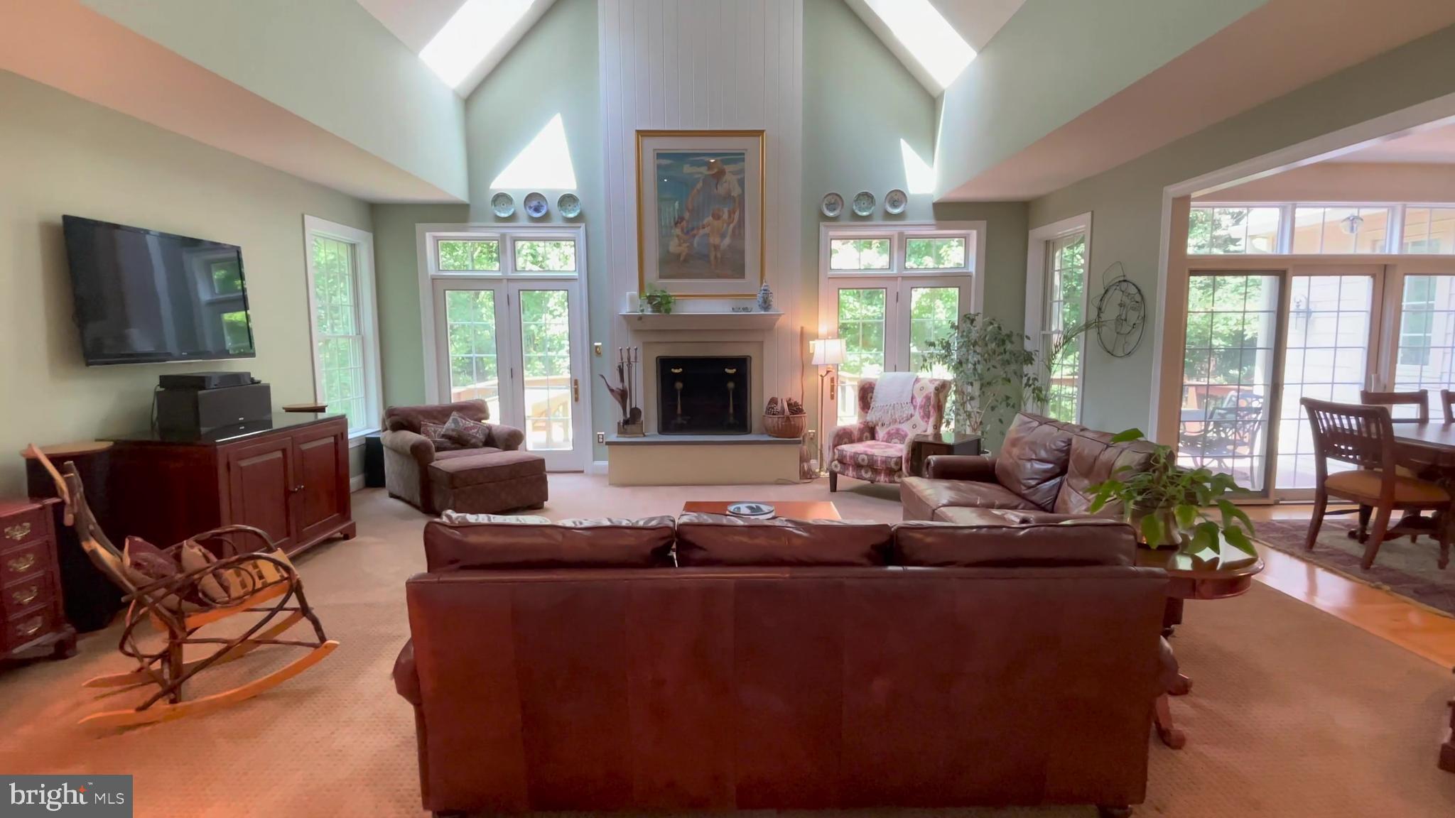 4 Paul Road Wayne, PA 19087 - Photo 10 of 46 a living room with furniture a large window and a flat screen tv