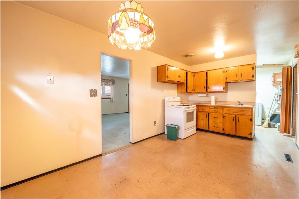 222 Ridgefield Drive Greensburg, PA 15601 - Photo 11 of 28 a kitchen that has a lot of cabinets a island and stainless steel appliances