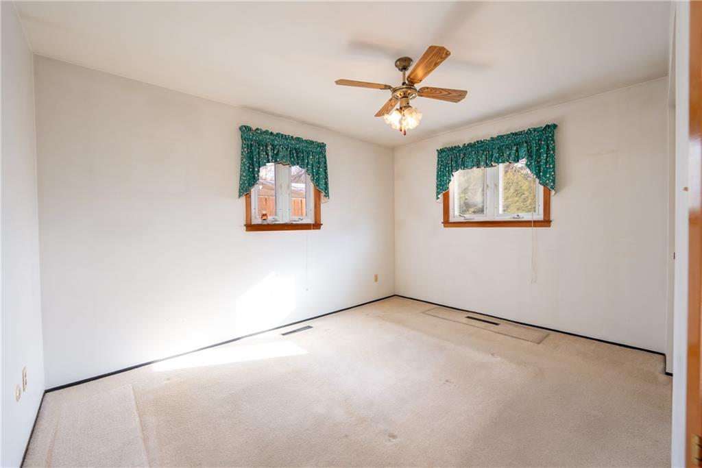 222 Ridgefield Drive Greensburg, PA 15601 - Photo 16 of 28 an empty room with windows and fan