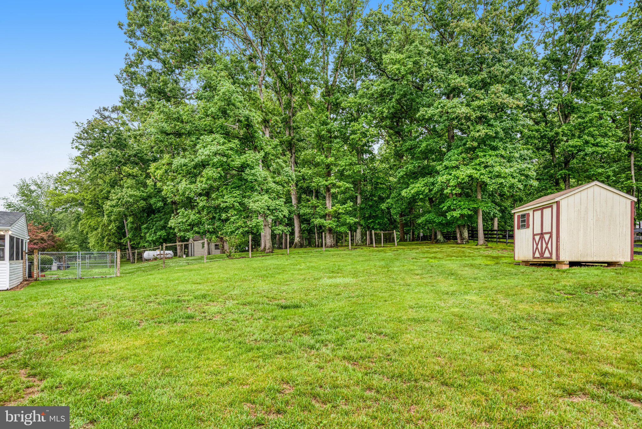 7961 Leeds Manor Road Marshall, VA 20115 - Photo 34 of 40 a view of a big yard with a house in the background
