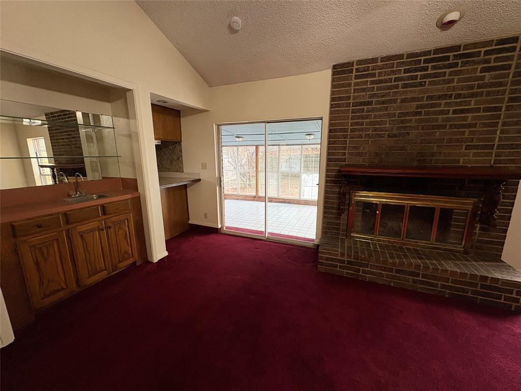 1838 West Taylor Street Sherman, TX 75092 - Photo 12 of 33 a living room with furniture and a fireplace