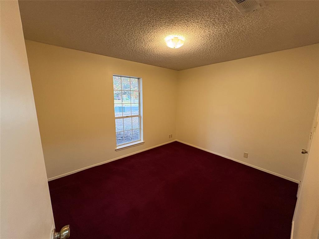 1838 West Taylor Street Sherman, TX 75092 - Photo 18 of 33 an empty room with a window