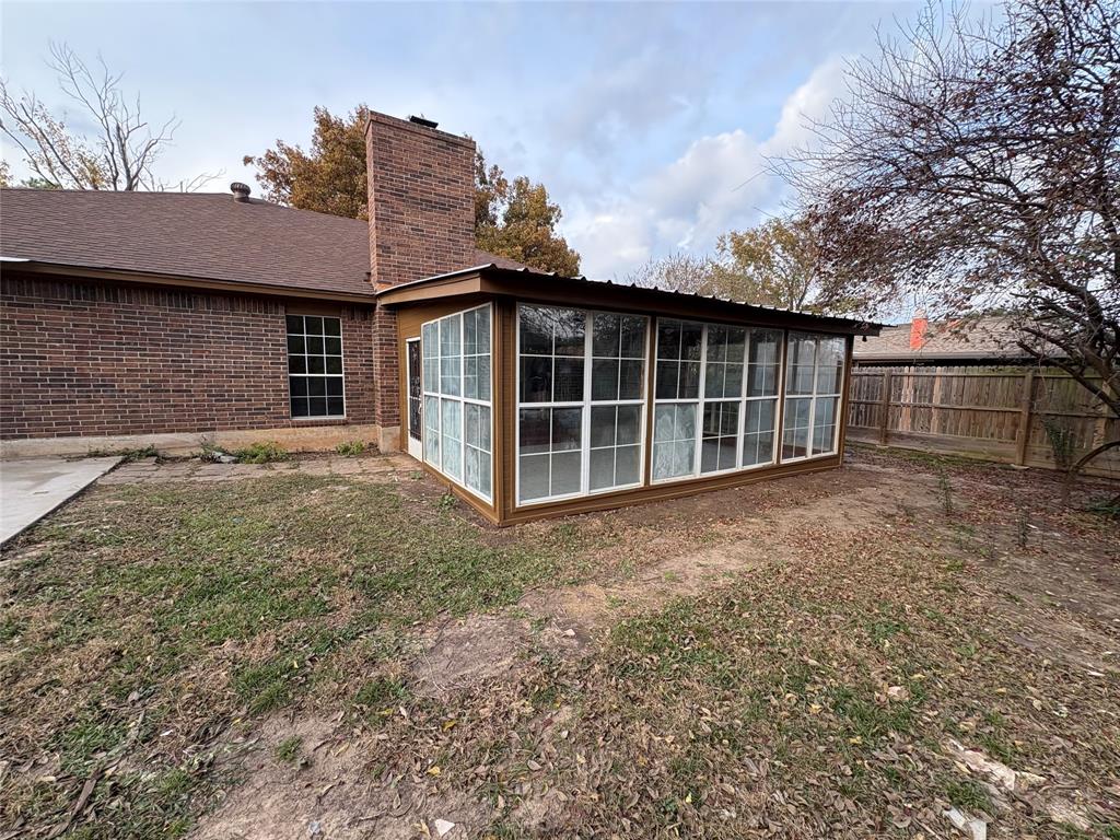 1838 West Taylor Street Sherman, TX 75092 - Photo 26 of 33 a view of a house with a yard and garage