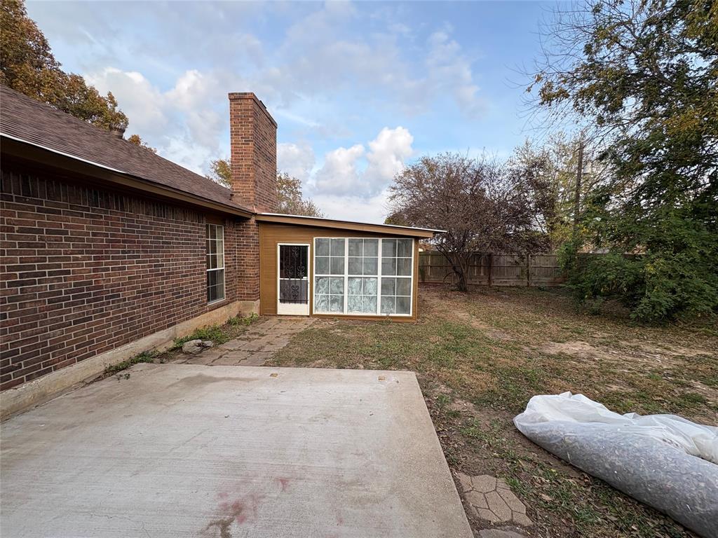 1838 West Taylor Street Sherman, TX 75092 - Photo 30 of 33 a backyard of a house with large trees and barbeque oven