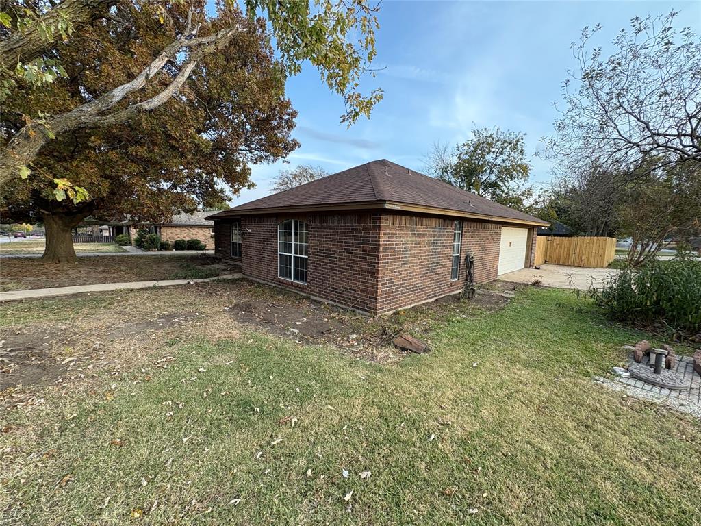 1838 West Taylor Street Sherman, TX 75092 - Photo 31 of 33 a view of a house with a yard