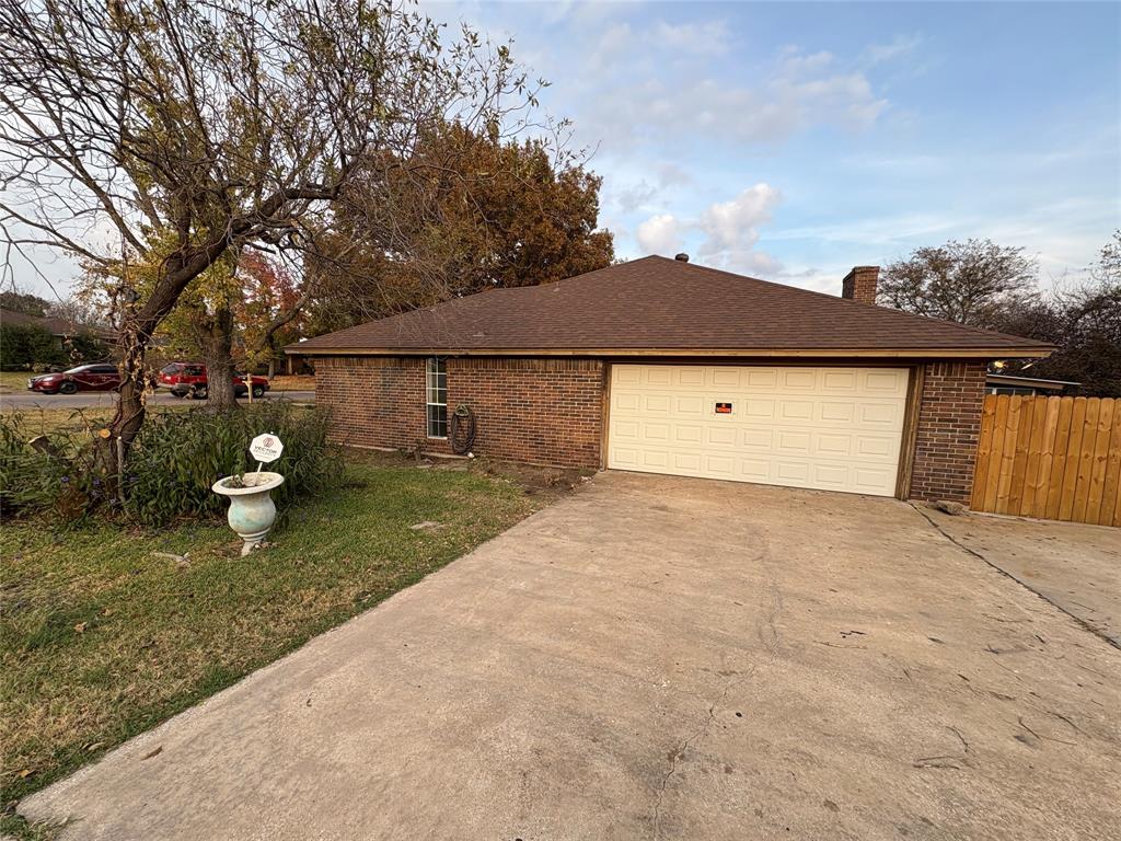 1838 West Taylor Street Sherman, TX 75092 - Photo 32 of 33 a front view of a house with a yard and trees