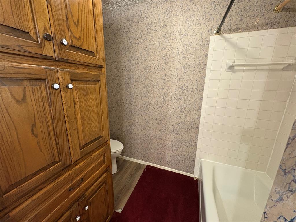 1838 West Taylor Street Sherman, TX 75092 - Photo 9 of 33 a view of a room with wooden door