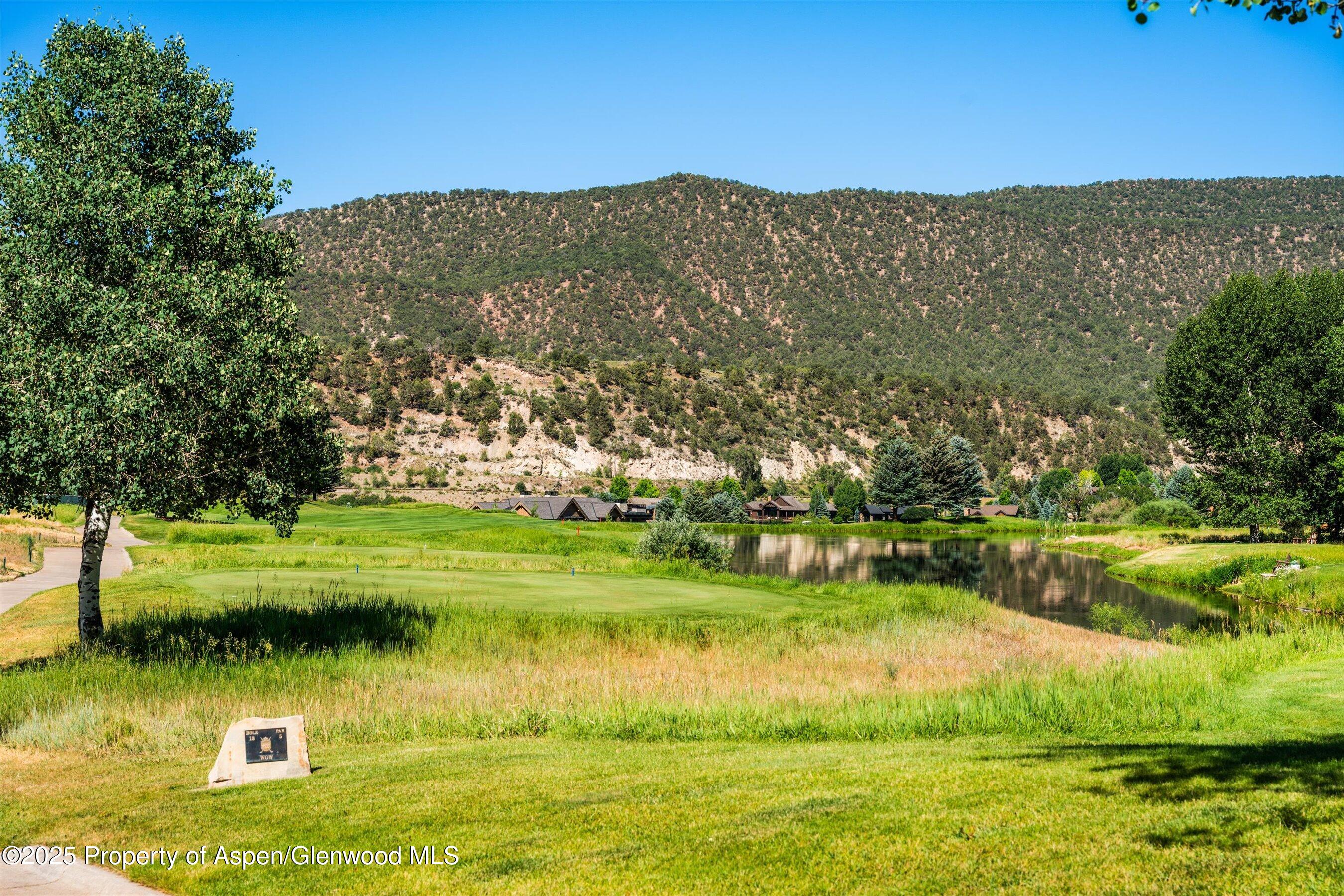 57 Diamond A Ranch Road Carbondale, CO 81623 - Photo 7 of 18 a view of a lake with a mountain in the background