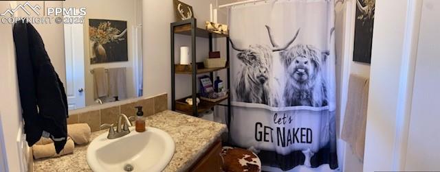 6855 Lauppe Road Yoder, CO 80864 - Photo 12 of 27 a bathroom with a mirror and a sink