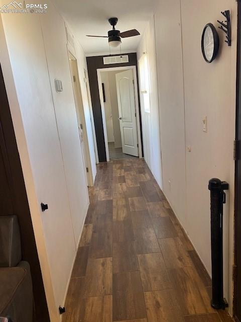 6855 Lauppe Road Yoder, CO 80864 - Photo 16 of 27 a view of a hallway with wooden floor
