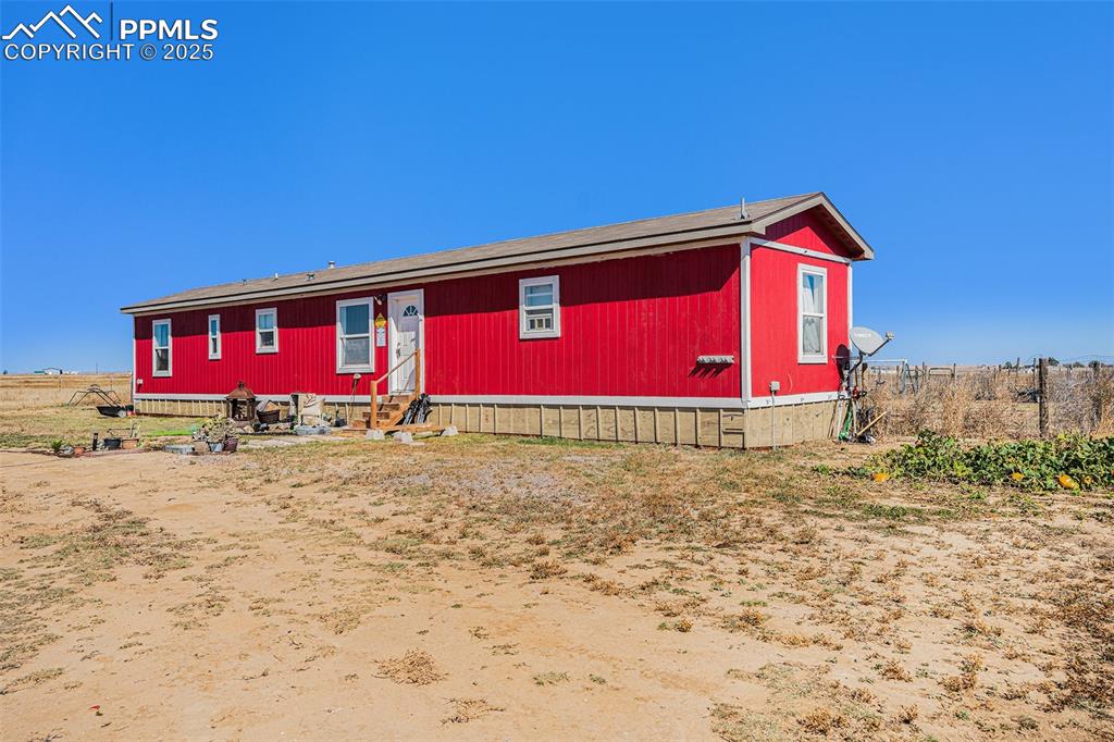 6855 Lauppe Road Yoder, CO 80864 - Photo 2 of 27 a front view of house with yard
