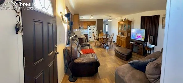 a living room with furniture and a flat screen tv