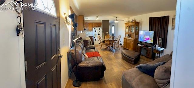 6855 Lauppe Road Yoder, CO 80864 - Photo 4 of 27 a living room with furniture and a flat screen tv