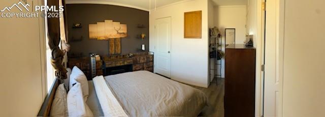 6855 Lauppe Road Yoder, CO 80864 - Photo 6 of 27 a bed room with a bed and a mirror