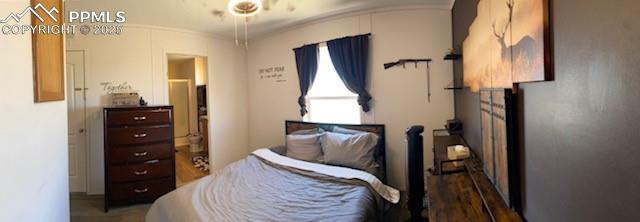 6855 Lauppe Road Yoder, CO 80864 - Photo 7 of 27 a bedroom with a bed and wooden floor