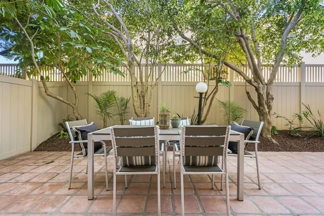 a view of an outdoor space with a table and chairs