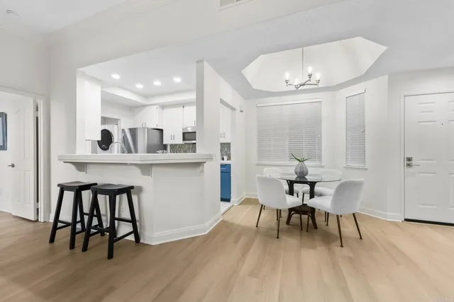 a dining room with furniture and wooden floor