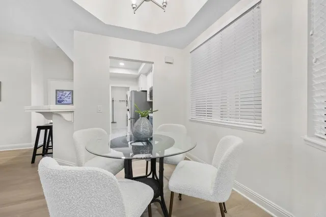 a dining room with furniture and window