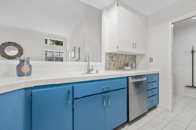 a kitchen with cabinets and window