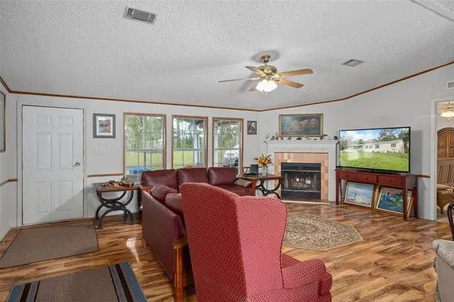 a kitchen with stainless steel appliances granite countertop a refrigerator a stove top oven a sink dishwasher and wooden cabinets