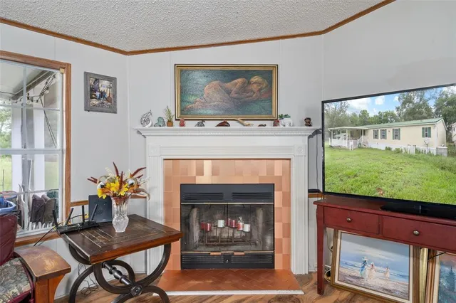 a kitchen with a stove a sink a dining table and chairs