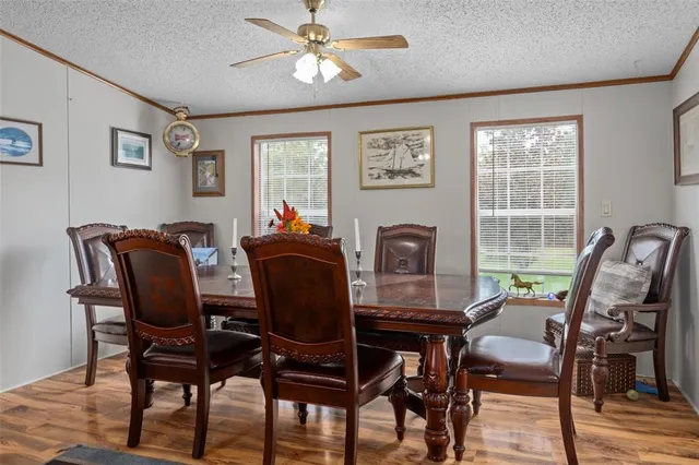 a kitchen with stainless steel appliances a refrigerator a sink a stove and cabinets