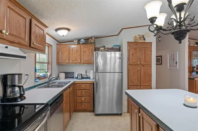 a bed room with a bed and a chandelier