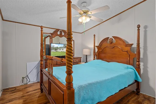 a bathroom with a granite countertop sink toilet and a mirror