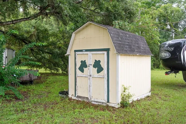 a view of a field with trees