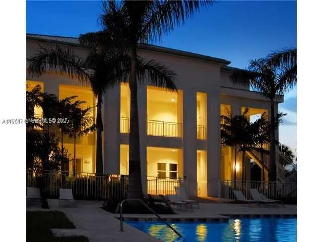 a view of a house with a swimming pool and porch