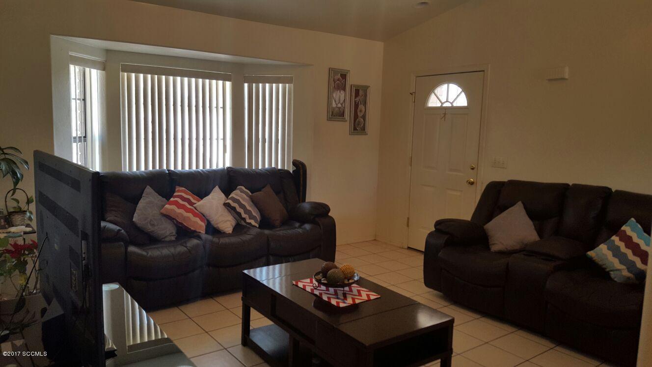 976 Calle Coyote Rio Rico, AZ 85648 - Photo 2 of 12 a living room with furniture and a window